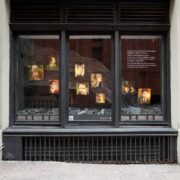 A picture containing building, outdoor, stone, store Description automatically generated