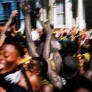 A picture containing blurry, crowd Description automatically generated