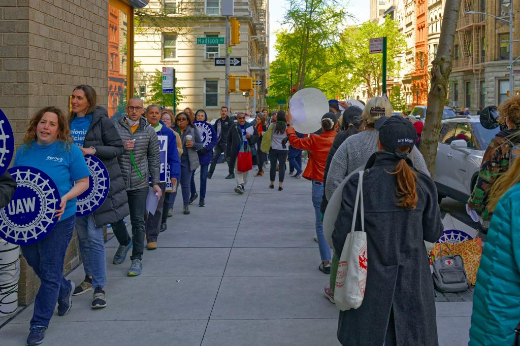 Workers picketing outside of The Hispanic Society's Chairman of the Board Philippe De Montebello's apartment building on April 20. Photographed courtesy of Maida Rosenstein.