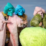 A group of people wearing clothing Description automatically generated