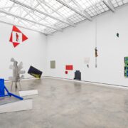 A room with art pieces on the wall AI-generated content may be incorrect.