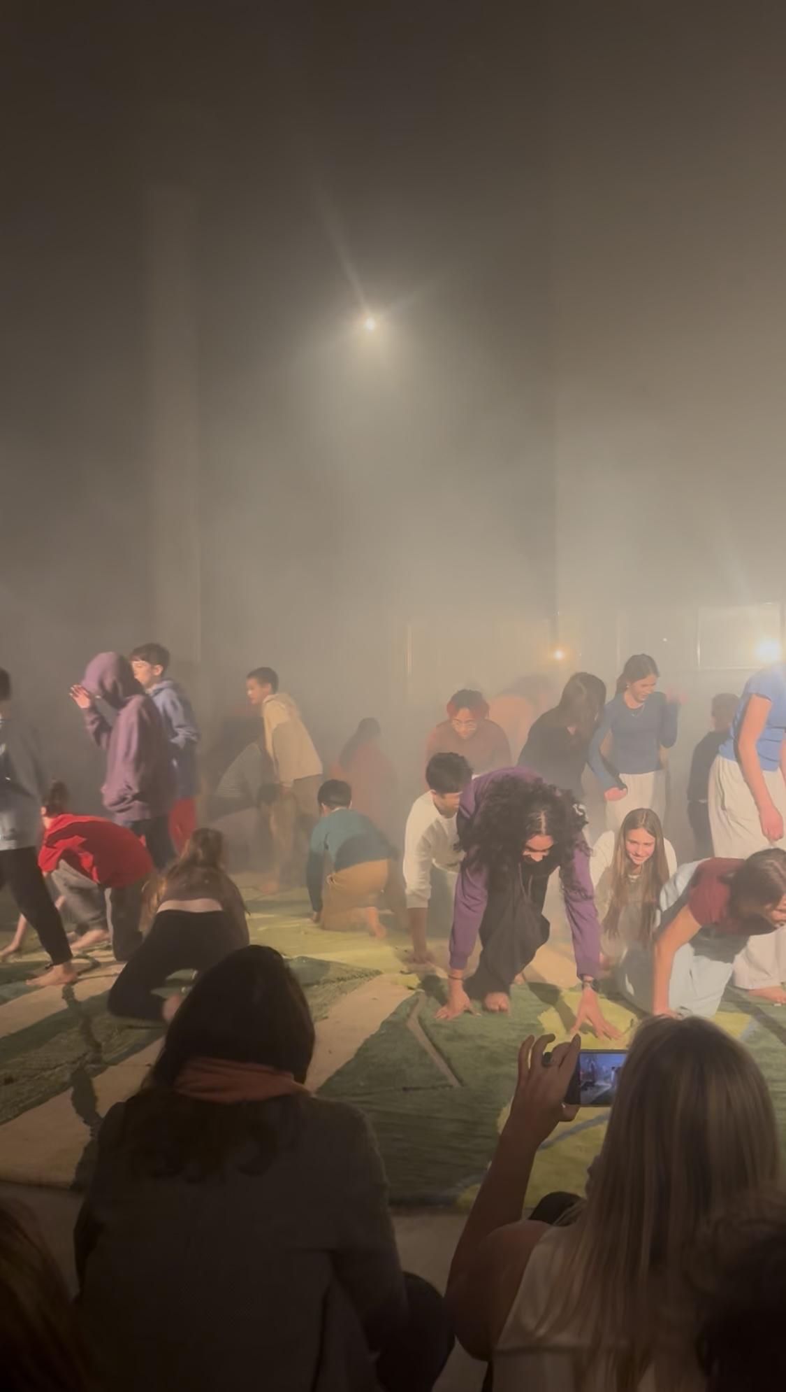 A group of people in a roomAI-generated content may be incorrect.