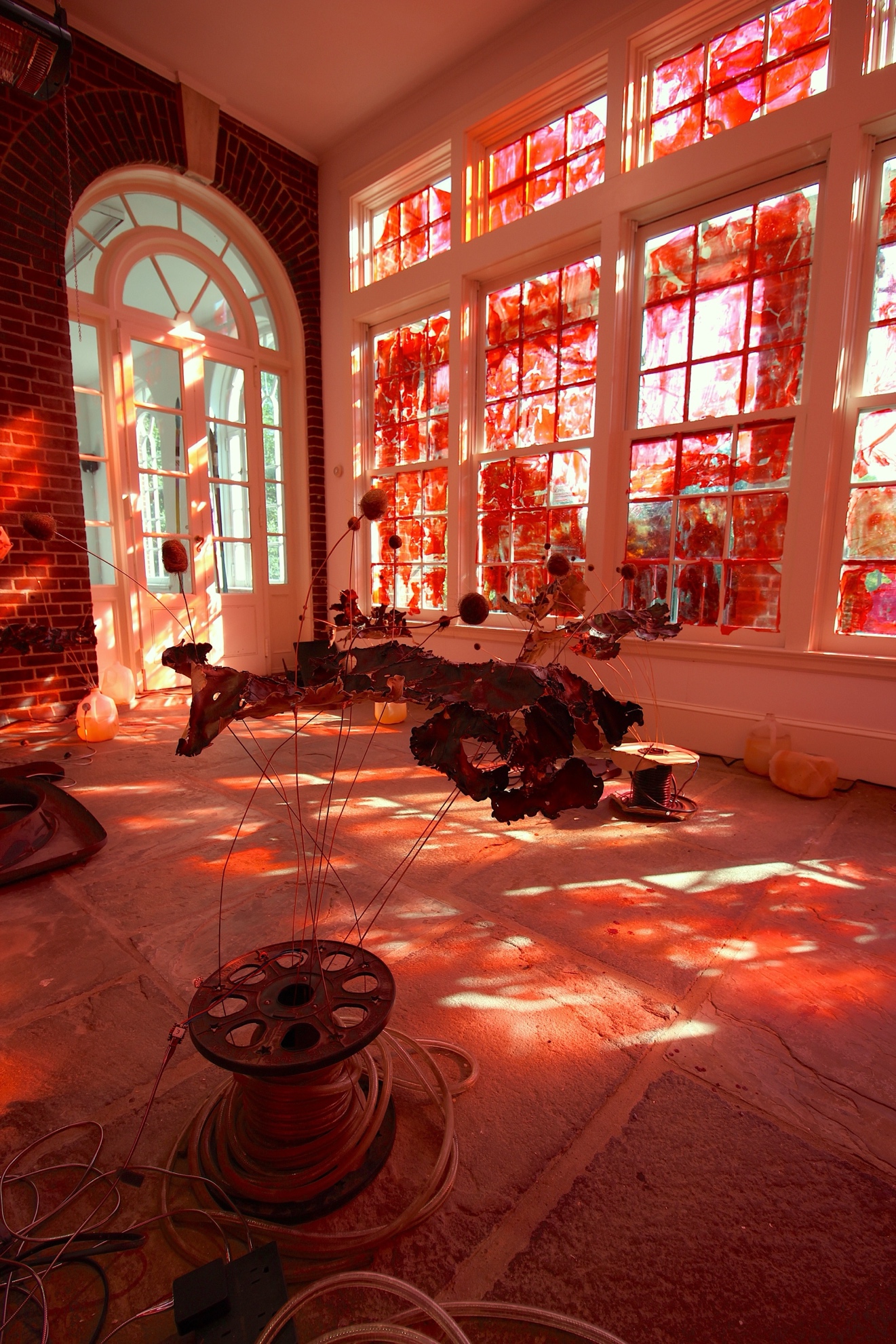 A room with stained glass windowsAI-generated content may be incorrect.