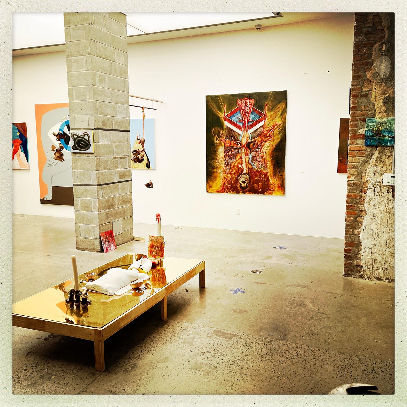 A room with art on the wallDescription automatically generated