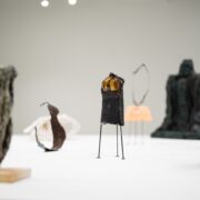 A group of sculptures on a table AI-generated content may be incorrect.