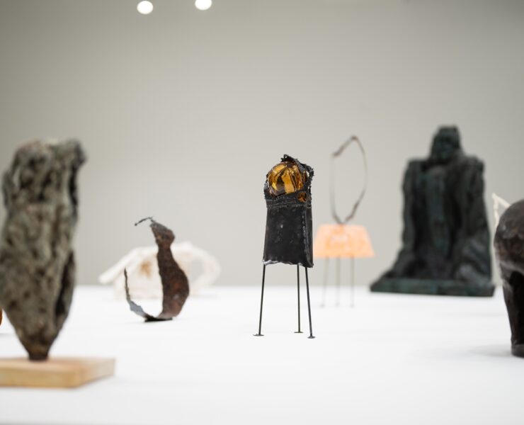 A group of sculptures on a table AI-generated content may be incorrect.