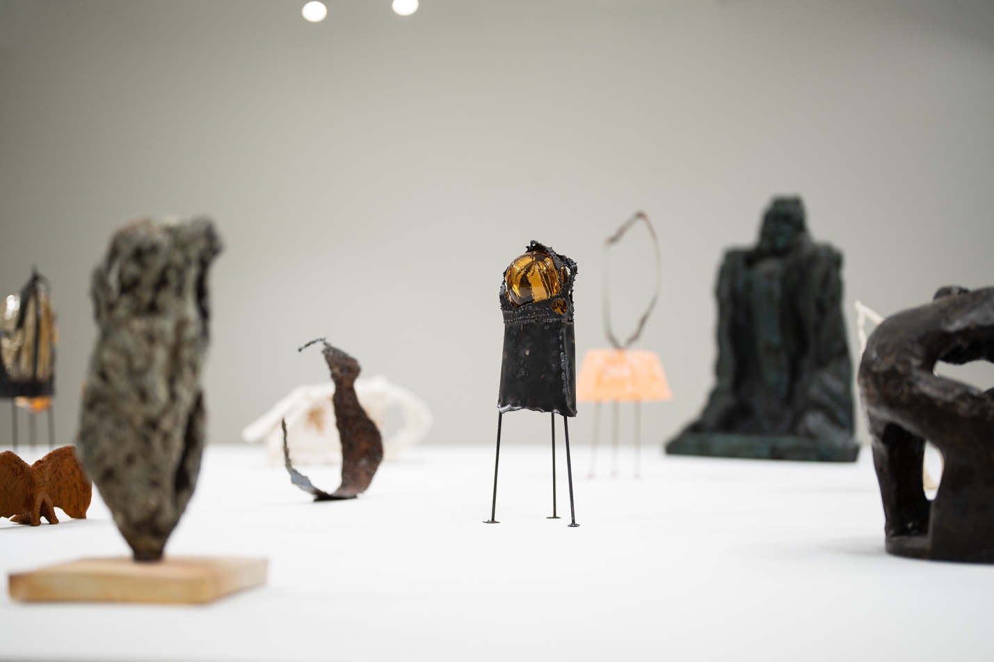 A group of sculptures on a table AI-generated content may be incorrect.