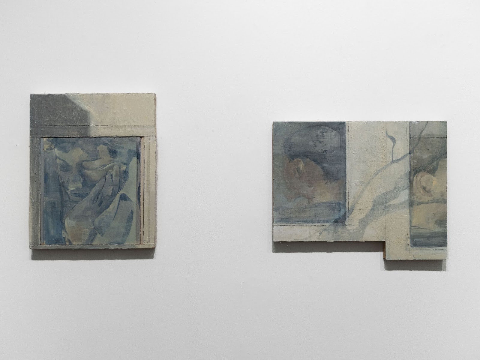 A couple of paintings on a wall

Description automatically generated