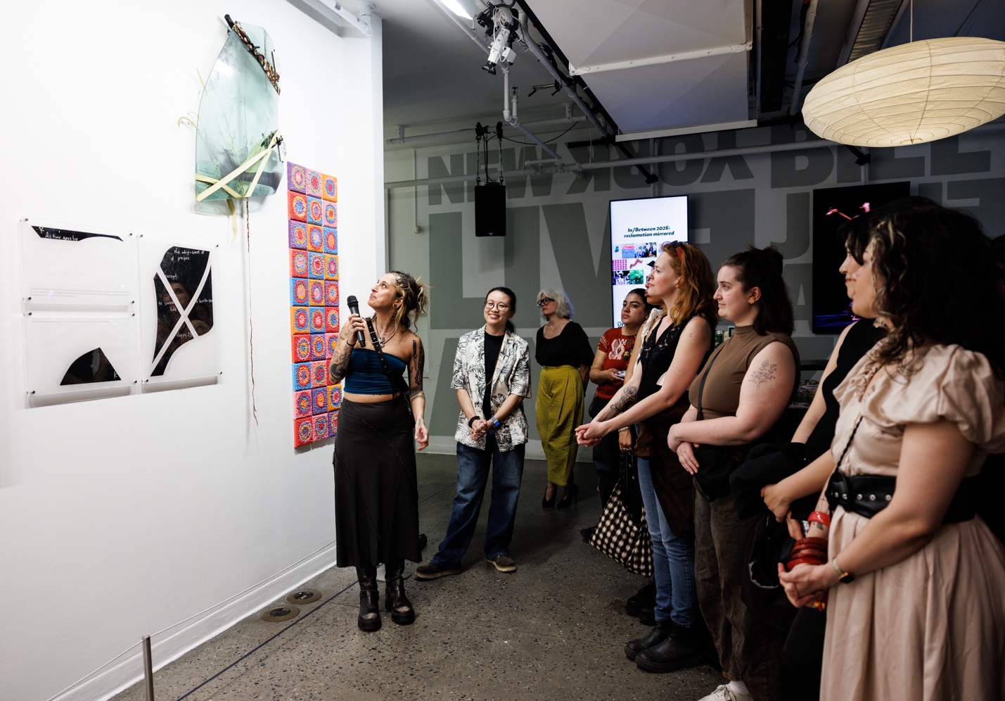 A person speaking to a group of peopleDescription automatically generated