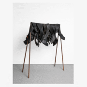 A group of boots on a rack Description automatically generated